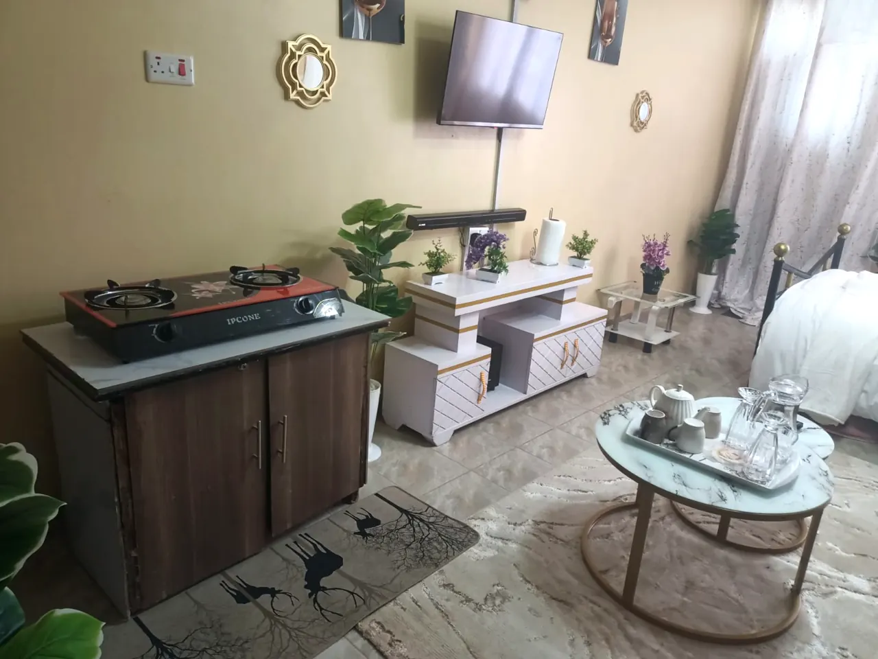 Two-burner gas cooker, TV unit and nesting marble tables
